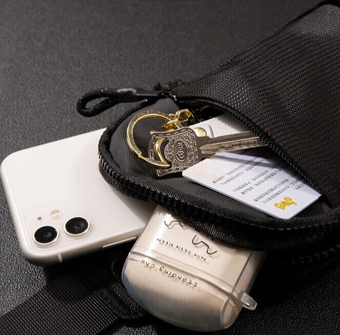 Kompakt rejsetaske med crossbody-rem