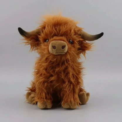 Blød bamse i form af en Highland-ko i krammevenligt plys