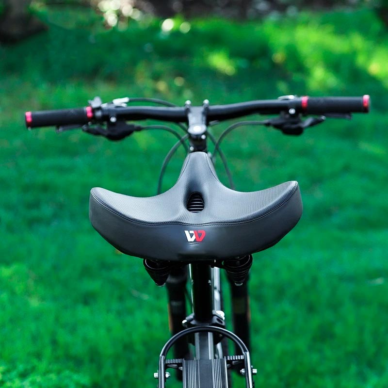 Ekstra bred ergonomisk cykelsadel med stødabsorberende polstring